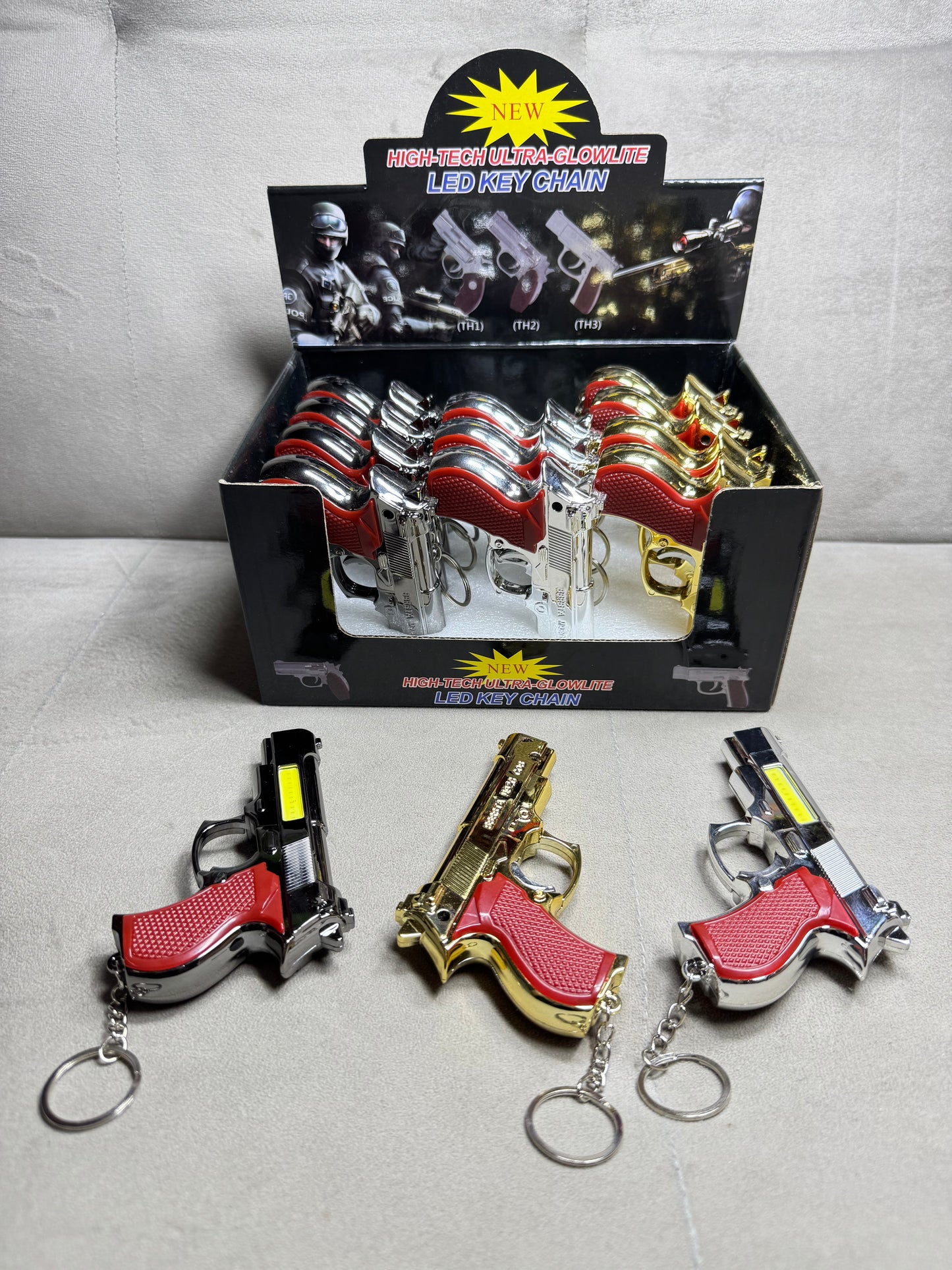Toy laser, flashlight gun keychain