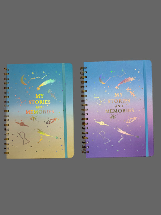 Two spiral-bound notebooks with decorative covers on a textured surface
