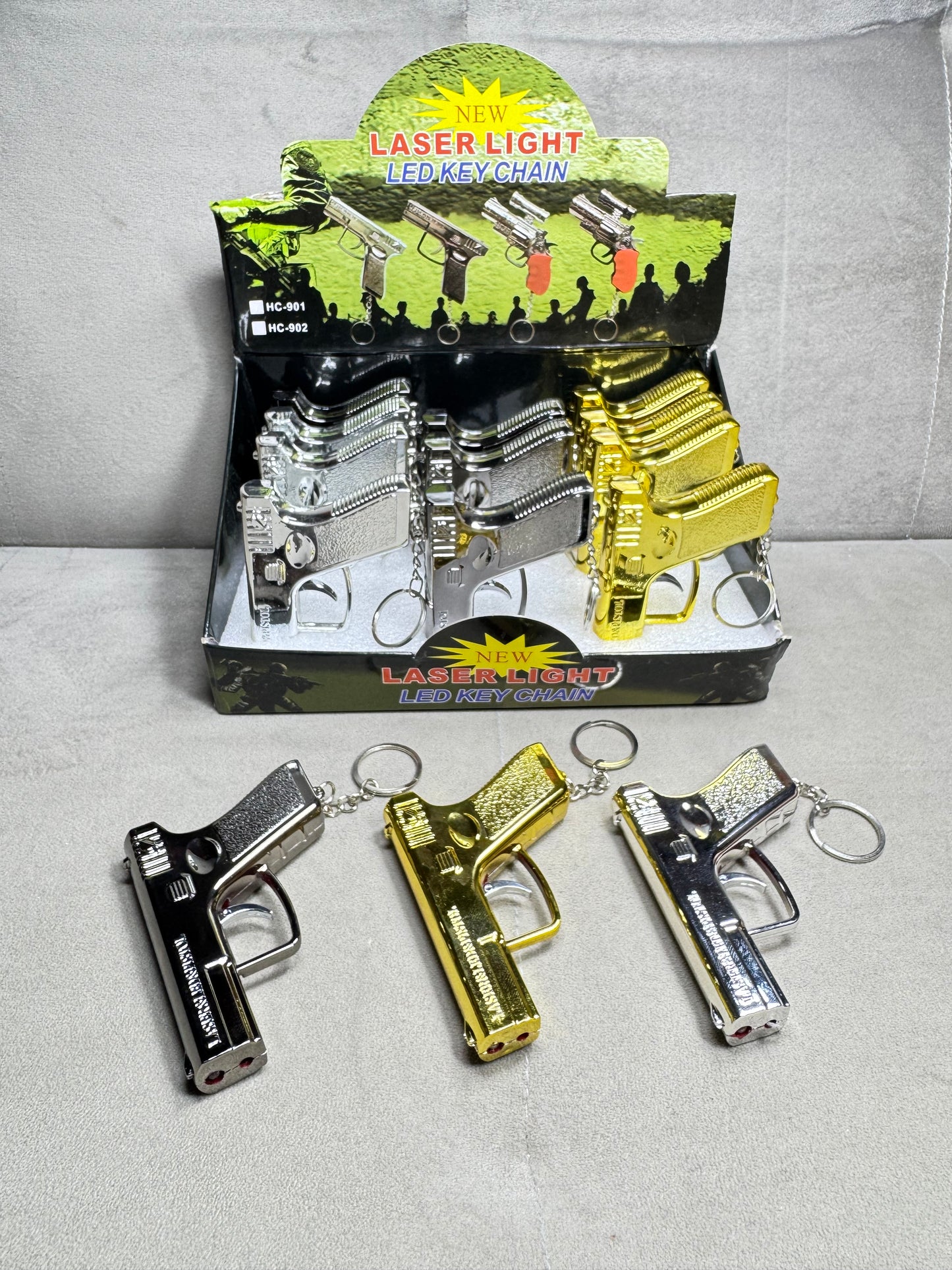 Toy laser, flashlight gun keychain